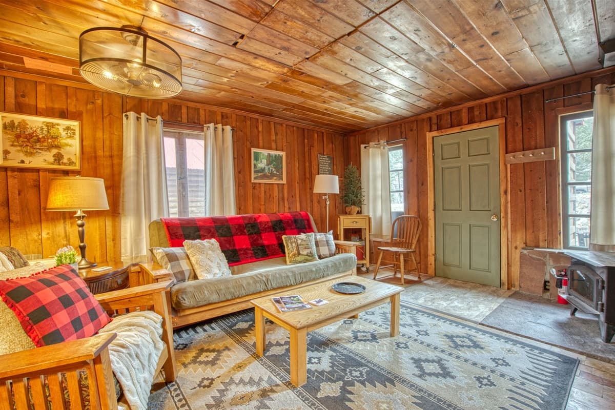Futon with bedding accommodates a third adult guest or a comfy spot for lounging in front of a roaring fire in the woodstove.